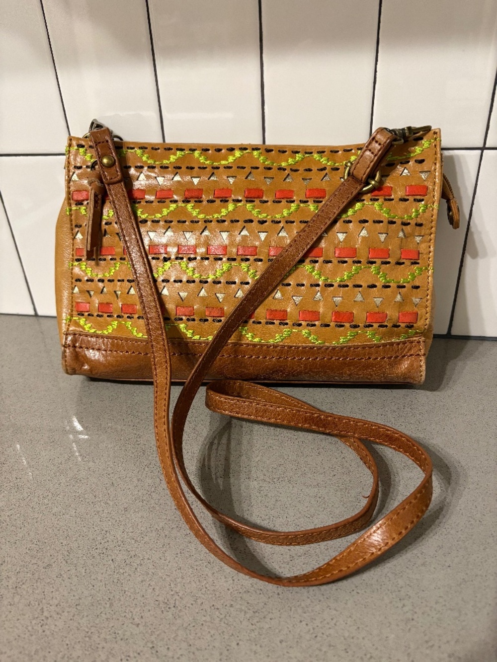 The Sak embroidered / woven leather crossbody bag